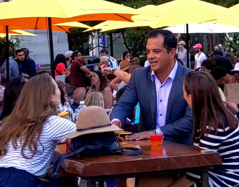 Crowd relaxing, enjoying autumn afternoon at "The Beach" in Campus Martius Park