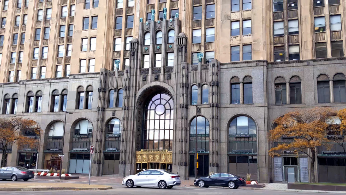 Tilt up from beautiful, ornate art deco entrance to Detroit's Fisher Building