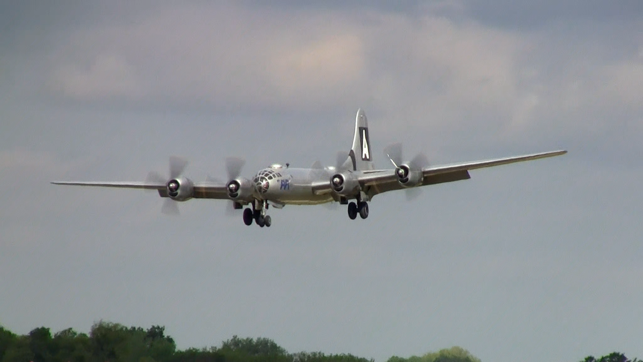 Incoming World War 2 B-29 bomber lands on the runway offering close-up viewing