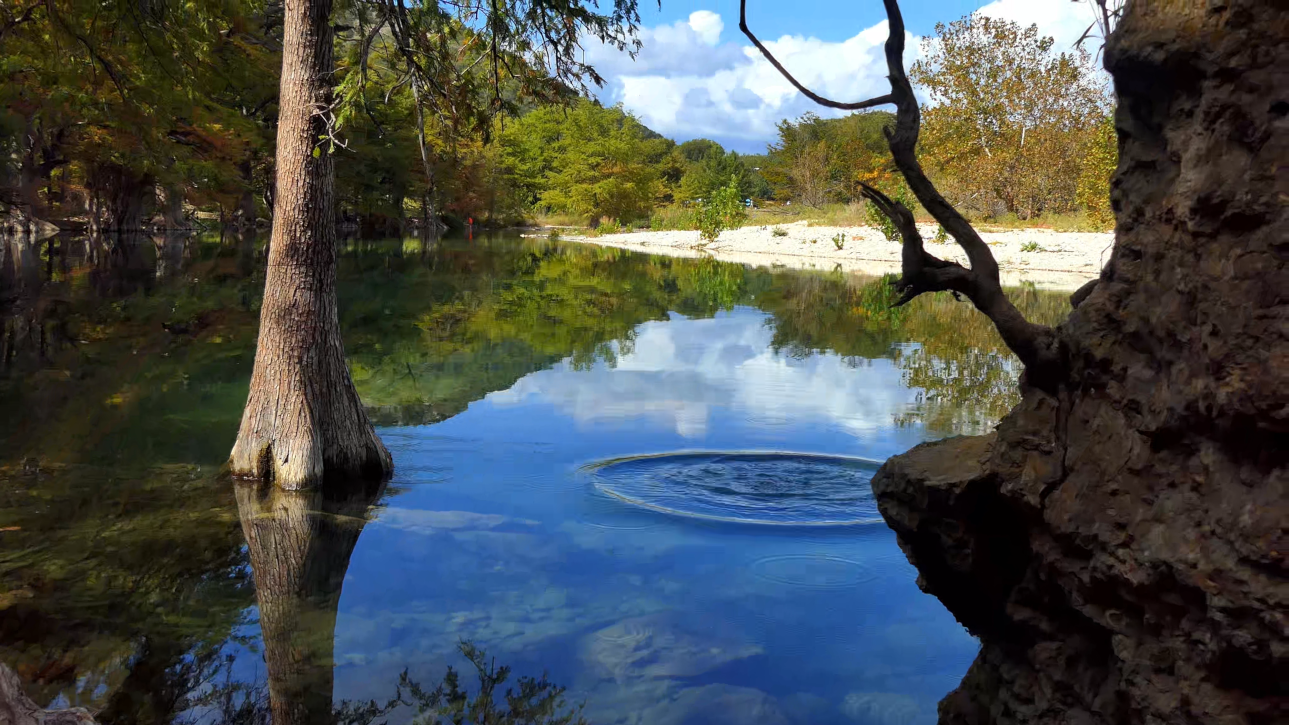 Peaceful ripples in beautiful calm, clear river in Texas Hill Country state park