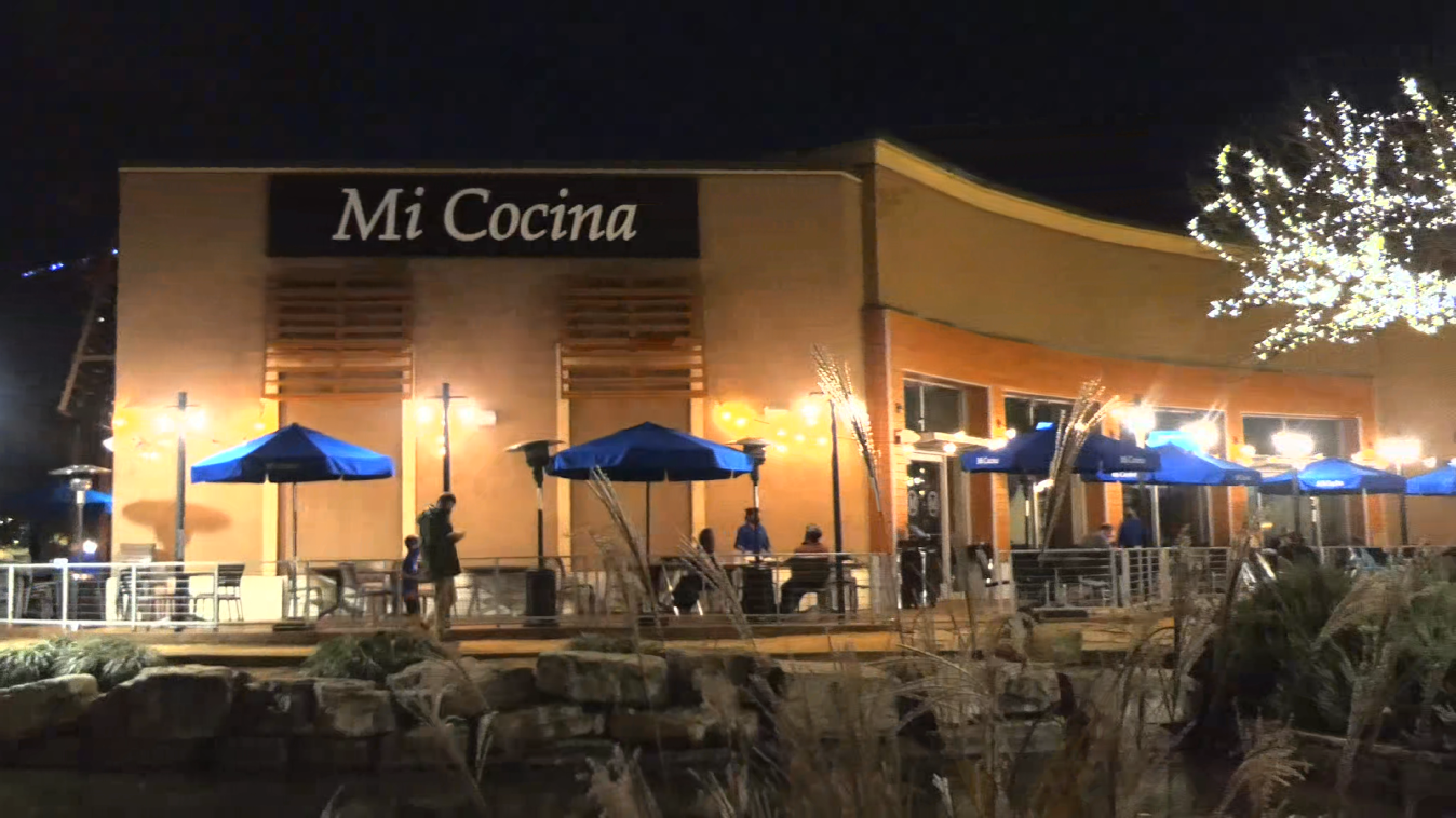 Mi Cocina Mexican restaurant at night with outside customers during pandemic