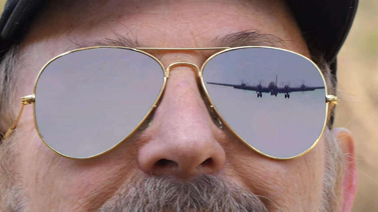 Cinemagraph Of Senior Man In Ray-Bans Showing B-29 Superfortress Bomber Landing Video