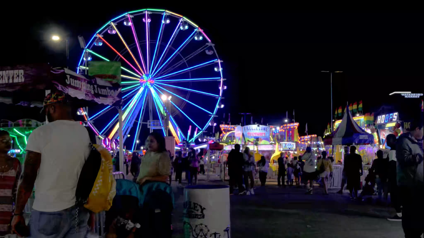 Time Lapse Of Crowd And Colorful Carnival Ferris Wheel On A Warm Spring Evening Video