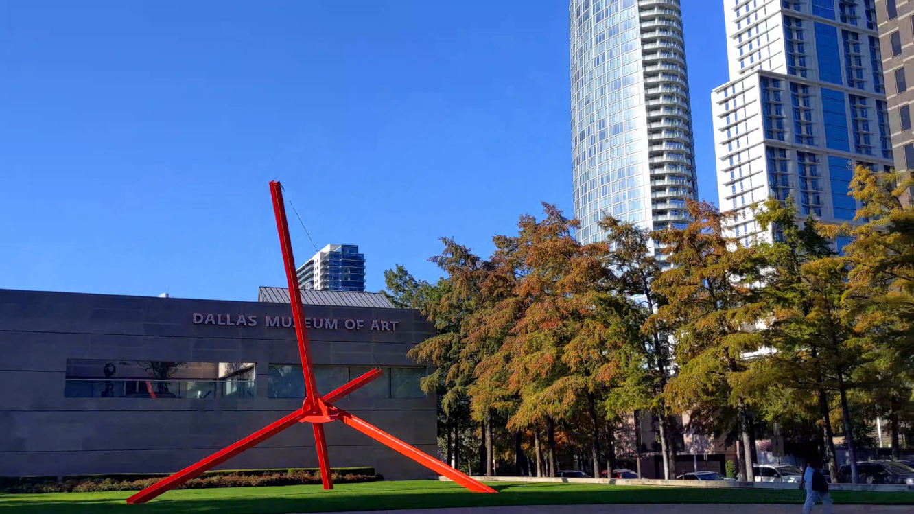 Pan & tilt up from outside Dallas Museum of Art to luxury high-rise apartments